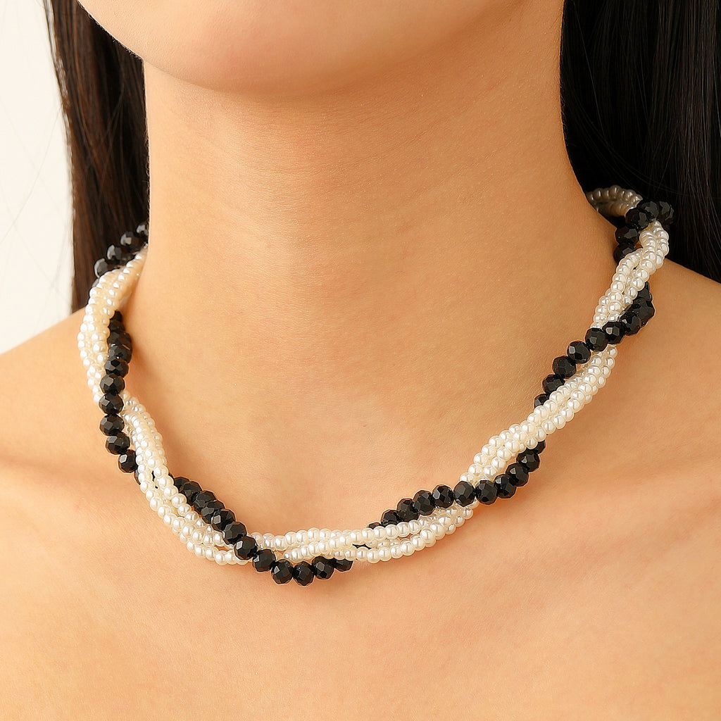 Multi-layered pearl jewelry set for women, featuring a trendy European and American style, with a V-shaped choker, bracelet, necklace, and earring design.