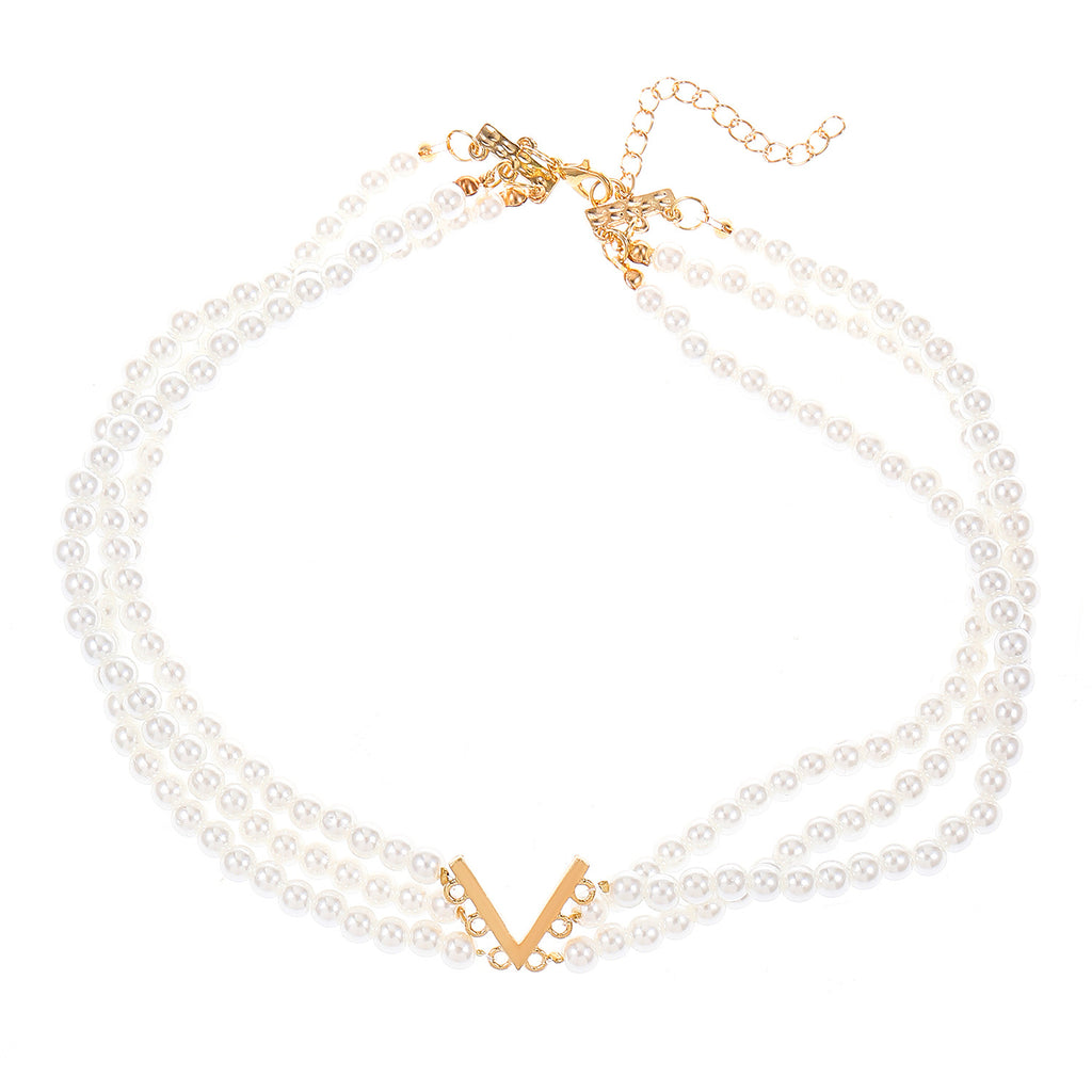 Multi-layered pearl jewelry set for women, featuring a trendy European and American style, with a V-shaped choker, bracelet, necklace, and earring design.