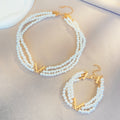 Multi-layered pearl jewelry set for women, featuring a trendy European and American style, with a V-shaped choker, bracelet, necklace, and earring design.